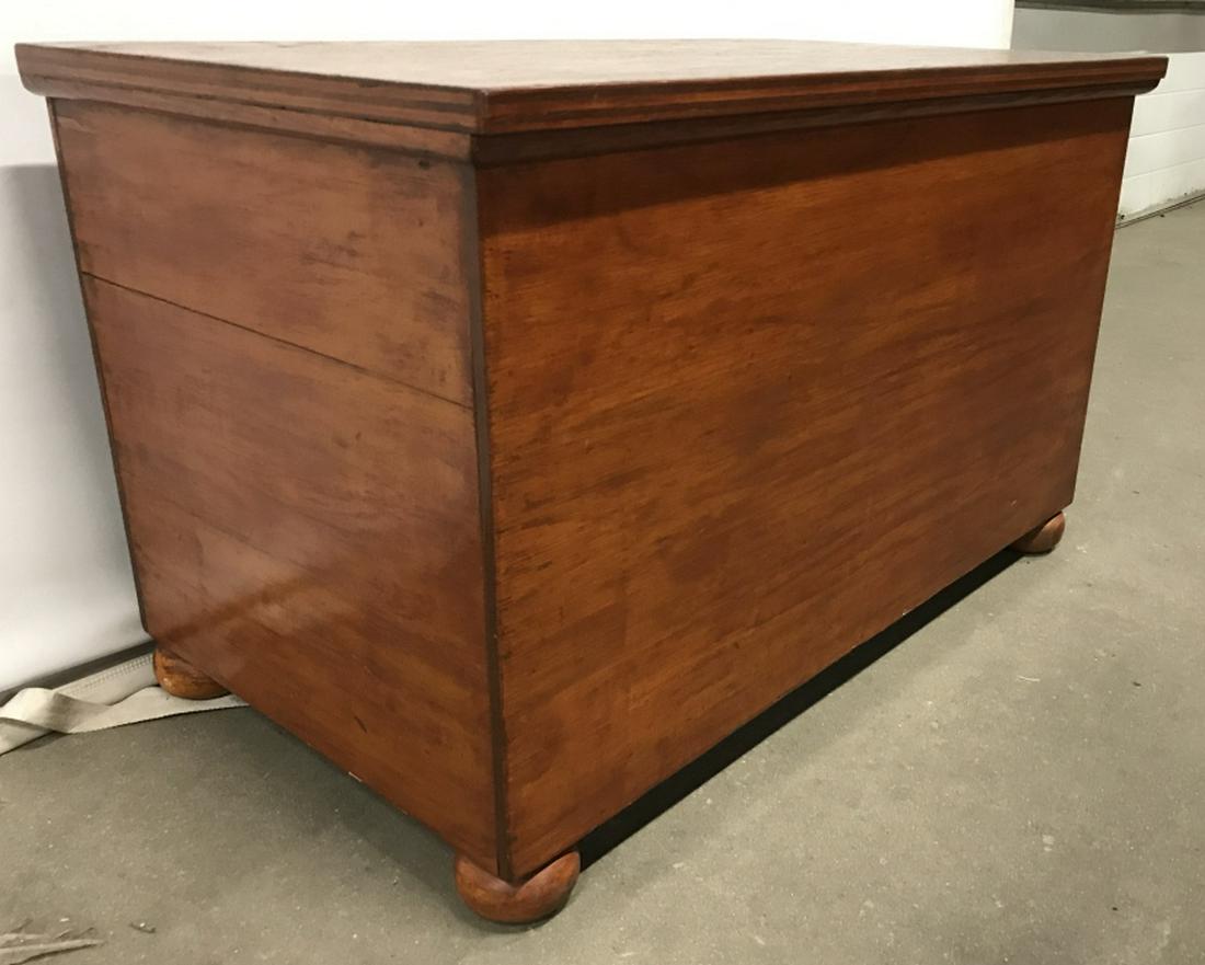 Vintage Bun Foot Carved Wooden Chest: Chest has light brown tone. Piece is wooden and contains 4 bun feet. Measures approx 31 inches long 18 inches deep 19 inches tall. Wooden chest, toy chest, storage chest. coffee table, storage, home f