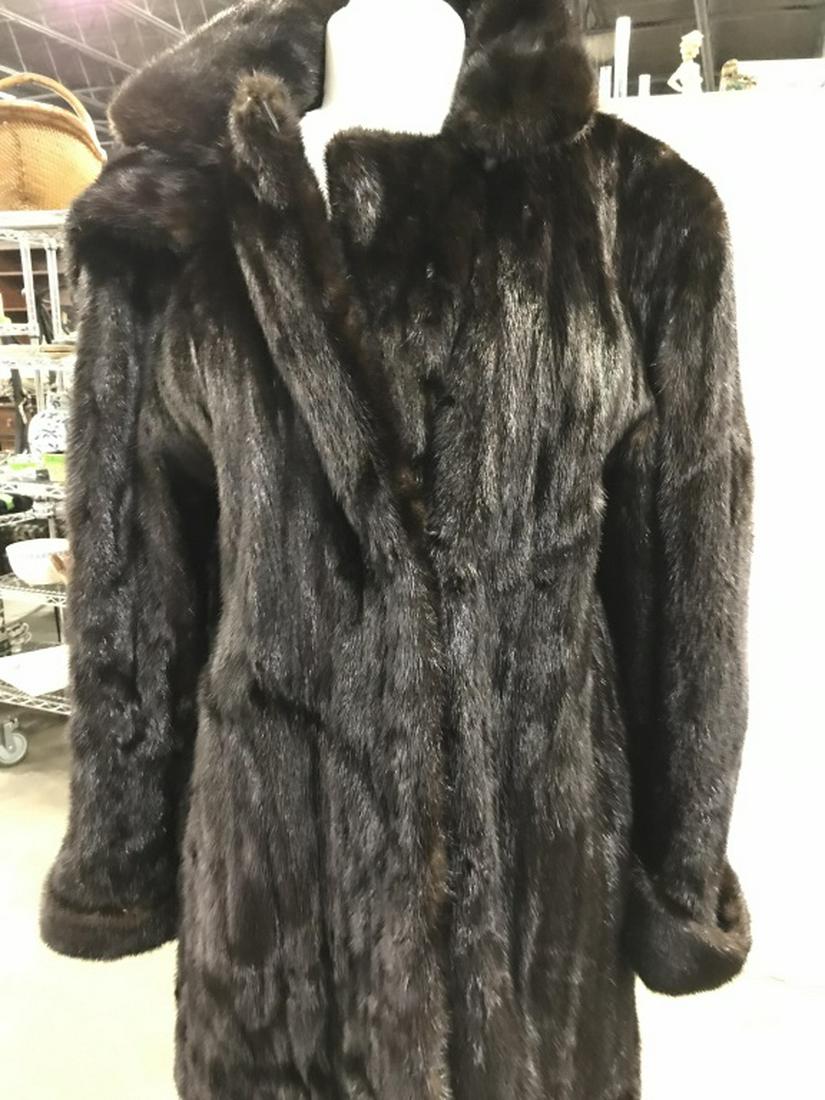 Hooded Authentic MINK Coat: Removable hood, unhooks. Thigh Length, from shoulders to end, 34 in. Outside pockets, velvet lined & clean. Turned up cuffs. Shoulder to arm length, 24 in. Shoulder to shoulder, back seams, 17 in. wid