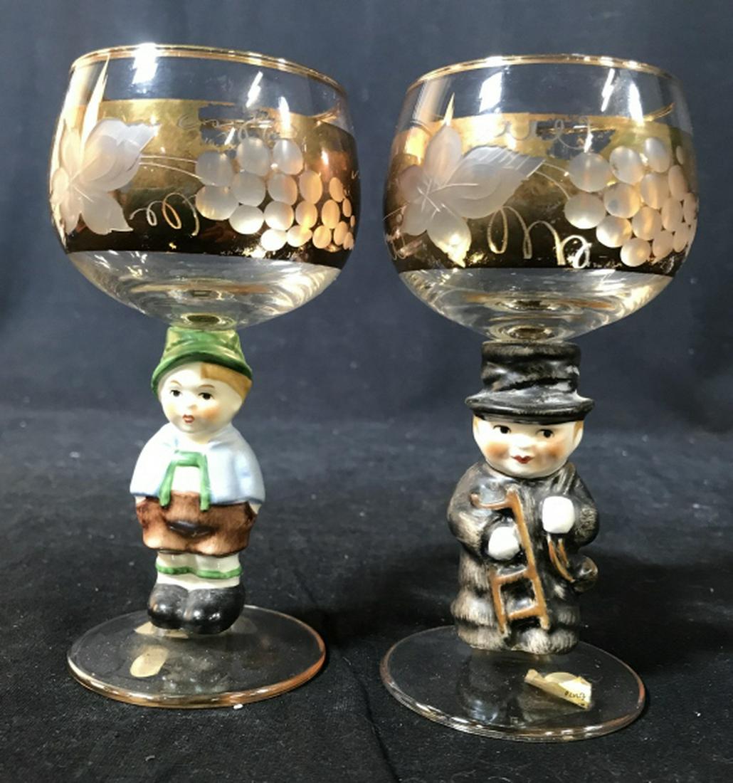 Pair Buckling Figural Stemware: Gold accented Figural stem German characitures, grape etched glass cups, Stemware, goblets, tableware, each Measures app ht 5 inches diameter app 3 inches, marked for Western Germany