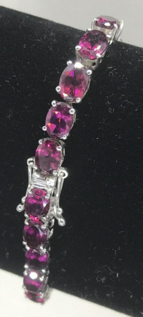 Raspberry Garnet Sterling Silver Bracelet: 26 Authentic Stones Of Garnet. Birthstone of January. Push button and secure clasp. Approx 6 x 5 mm. 7.5 in. Length. January Birthstone. Semi Precious Stones, Garnet, Raspberry Garnets, Sterling Silve