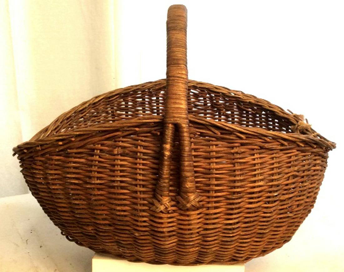 Group 3 Hand Woven Vintage Baskets: Vintage possibly Antique Woven Handle Baskets possibly Wicker, Wood & Rattan Largest Measures Height 29 inches Diameter 26 inches approximately. Planters, decorative accessories, magazine bins, rustic