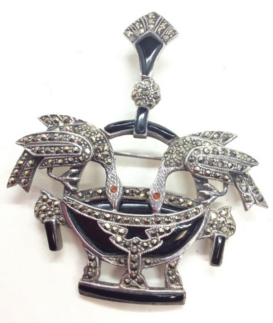 Sterling Silver W Onyx Marcasite Bird Pin: Two birds drinking from vessel, polished onyx pieces, Marcasite, and red toned rhinestones. With Loop, can be worn as pendant. Tested to be sterling, does not appear to be marked. Measures approx 3 by