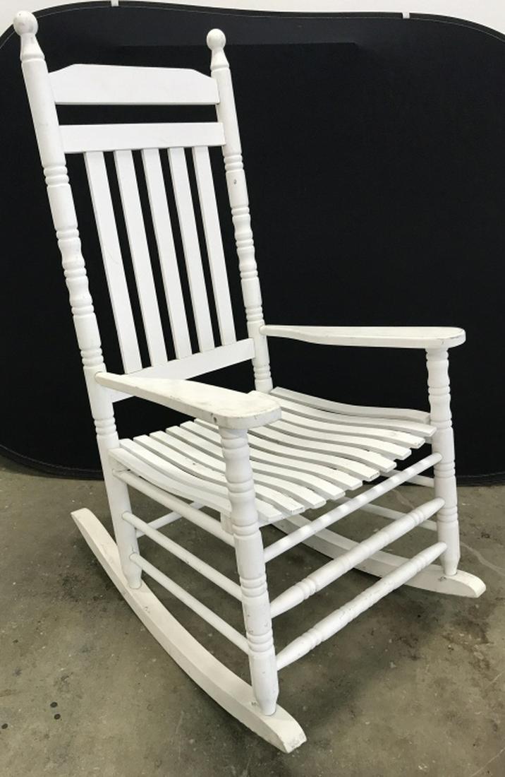 Vintage Painted Wood Rocking Chair: Rocking chair is white in tone. Measures approx 48 inches in height by 24 inches in width by 34 inches in depth. Chair has surface wear like scratches and scuffs, might need minor restoration. Vintage
