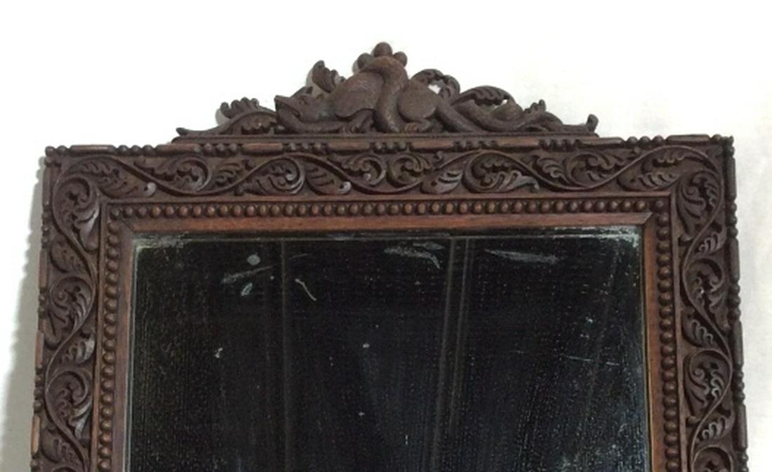 ANTIQUE Carved Wood Mirror: Type of Wood Unknown. Possibly Mahogany. Mirror has a detachable table stand and had a round screw to hang on a wall. Mirror can be easily replaced- in back, a wood piece covers the mirror inset. Mirr