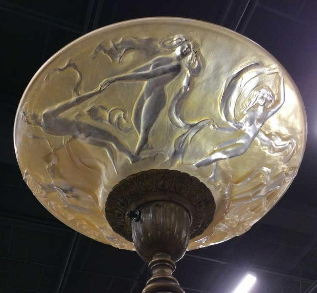 Art Nouveau Floor Lamp W Marble Detail: Art Nouveau Floor Lamp With Glass Shade. Tinted caramel glass shade with nude female figures dancing in relief. Brass style metal body with green toned onyx base. Measures approx 64.4 inches tall, 16.