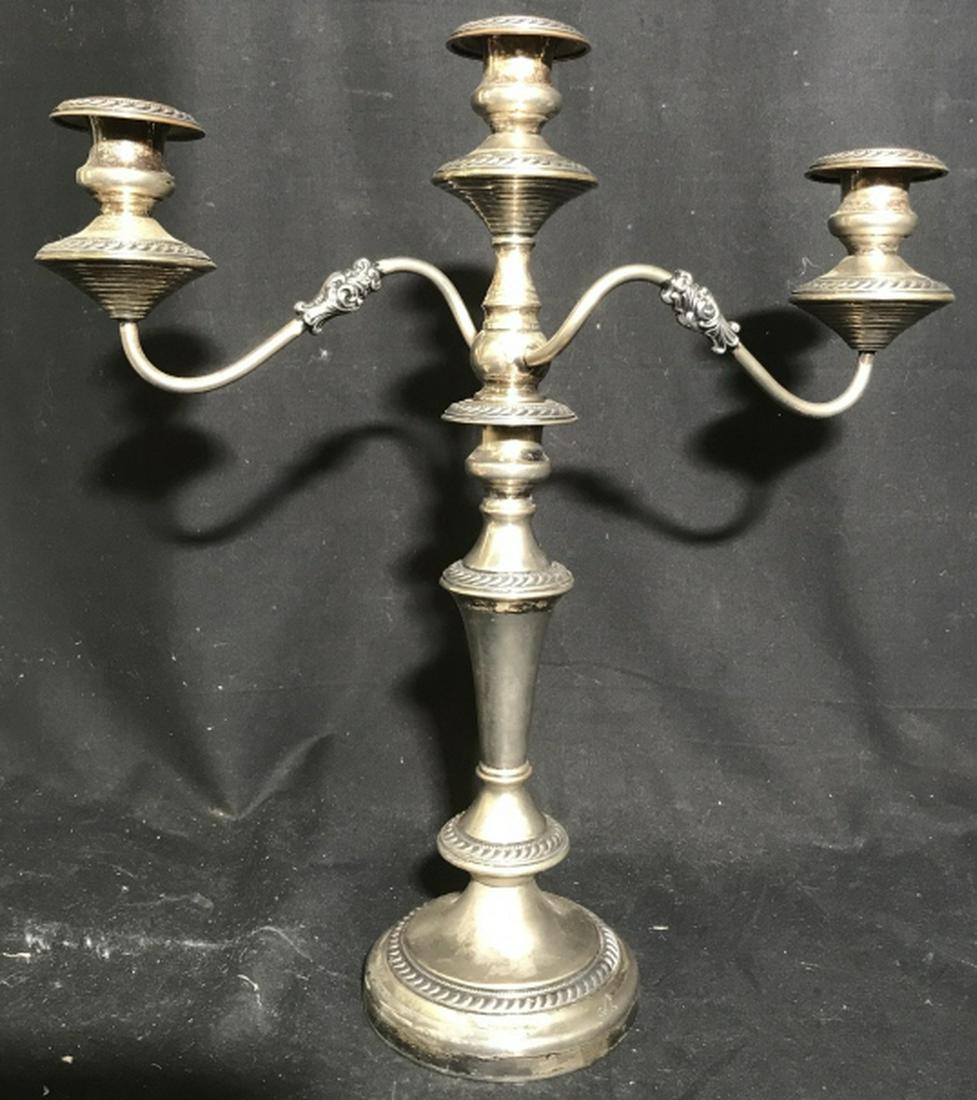 Silver Pl Candelabra w Extra Single Stand: One silver plate candelabra w three arms, multiple trademarks on underside, elaborate detailing, three arm candelabra removable, to make a pair of candle sticks, with three arms measures ht 20 inches 
