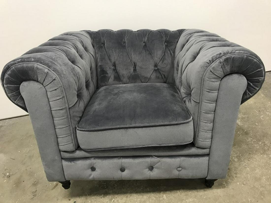Velvet Upholstered Chesterfield Club Chair: Smoke blue tone velvet upholstery with Tufted details. One back foot need replacing. Measures approx 31 inches in height by 44 inches in width by 35 inches in depth. Chesterfield couch, velvet upholst