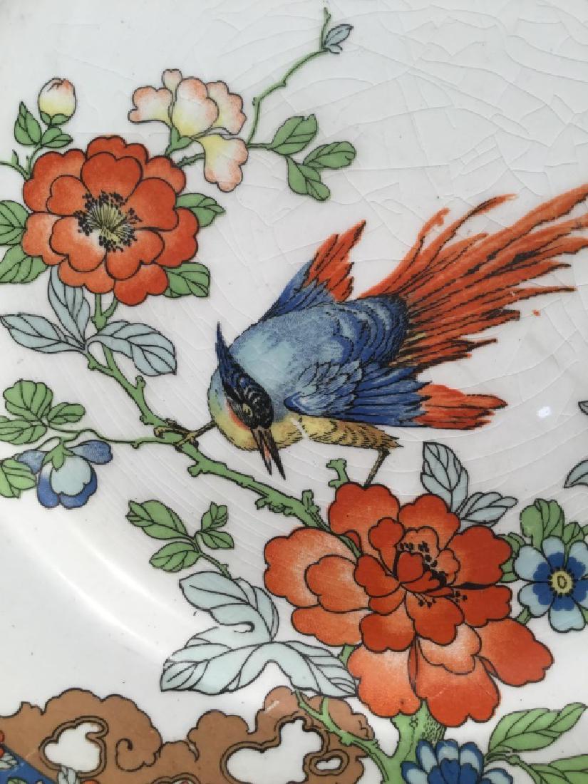 Framed Wood & Sons Ltd Antique Plate: Wood & Sons Ltd Antique plate patented in 1917. Plate features colorful bird motif. Underside of plate is marked for Wood & Sons, England, Patented March 21, 1917. Plate is set in deep gold tone wood