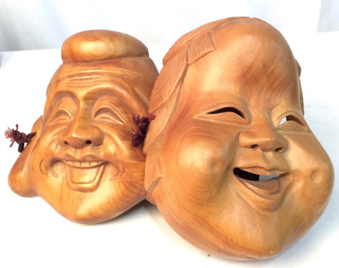 Wooden Buddha Mask Set: Two beautiful wooden Buddha face decorative masks. Made in Taiwan Republic Of China. Smaller mask measures at approx 8.5 inches tall and approx 8 in wide. Larger mask measures at approx 9.5 inches tal