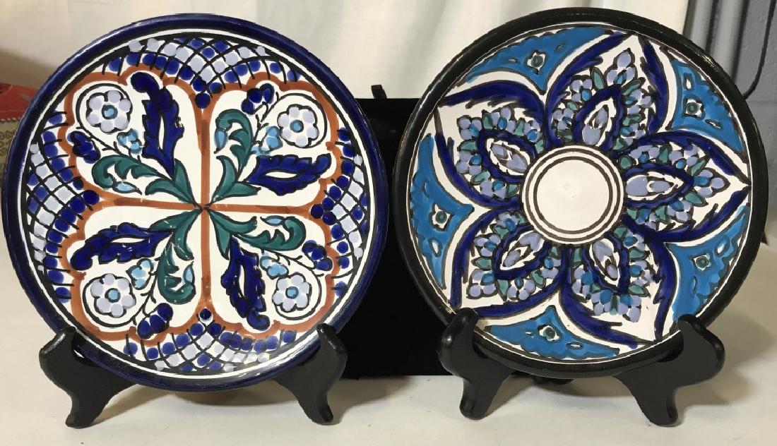 Handmade Ceramic Decor Plates: Both are wired to be displayed on the wall but can be displayed on a table. Hand Painted. Marked on underside. Have handcrafted Spanish/ Portuguese/ Italian Colors & Patterns. Unidentifiable. 7 in. Ve