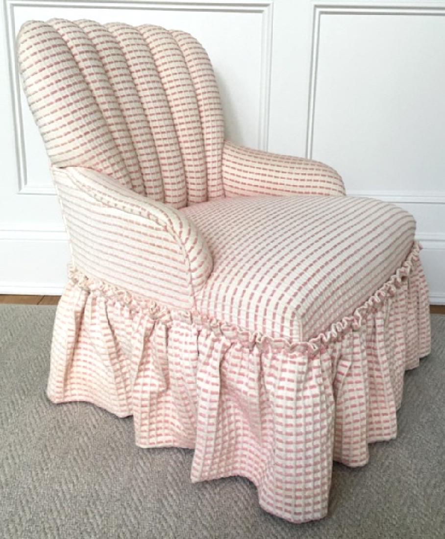 Petite Children’s Channel Back Chair: Chair has channel back with skirted bottom. Pink and white in tone. Measures approx 28 inches in height by 24 inches in width by 20 inches in depth. Some minor blemishes on fabric, might need cleaning