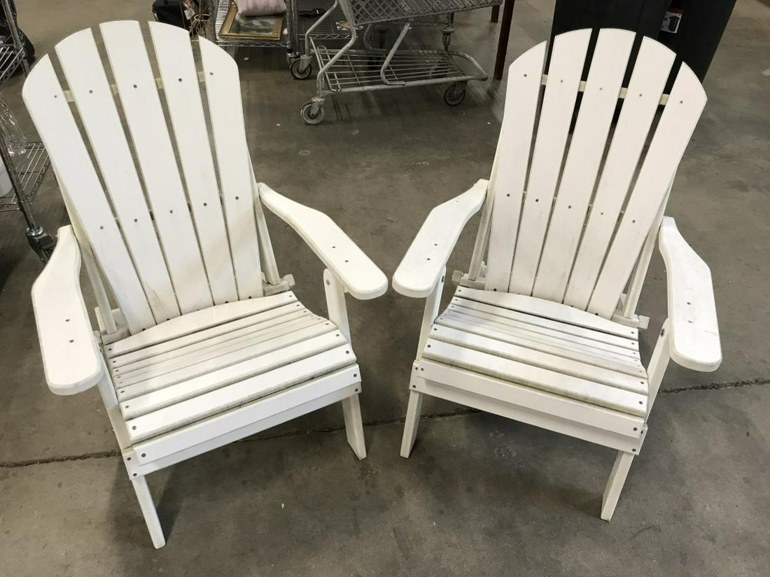 Pair Outdoor Lounge Armchairs: Pair of white toned outdoor lounge armchairs. Appear to be material composite. Chairs have minor surface wear like discoloration consistent with outdoor exposure. Each measures approx 37 inches in hei