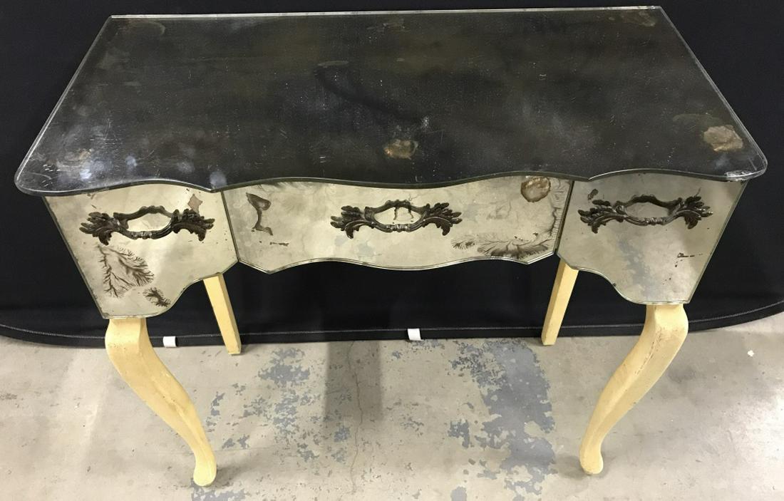 Vintage HICKMAN Mirrored Vanity Table: Interior of top left drawer is marked for HICKMAN. Table has three frieze drawers. Mirrored vanity sits atop four painted wood legs. Measures approx 30 inches in height by 30 inches in width by 14.75