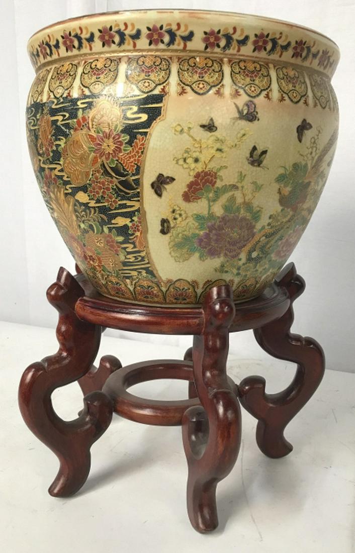 Royal Satsuma Porcelain Planter On Stand: Labeled underside for Royal Satsuma, Painted Asian Pottery, Ceramics, Porcelain Planter With Geometric, garden scenes, birds and butterflies, comes with Asian hardwood stand, measures together ht 18 i