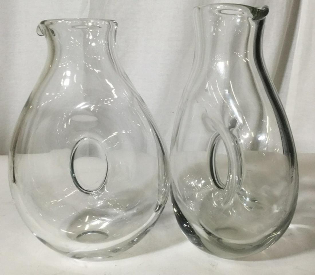 Pair Clear Glass Art Glass Pitchers: Jars are heavy glass. Center is closed. Liquids pass in a circular manner. 9.5 in. tall, 7 in. wide. art glass pitchers, water pitchers, barware, tableware, upscale vases