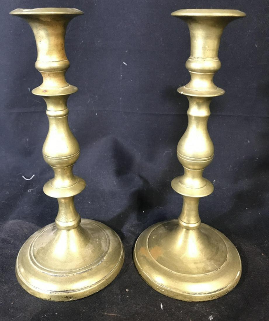 Pair Gold Toned Brass Candlesticks: Lot includes 2 gold toned Candlesticks. Each appears to be brass. Each measures approx 9.5 inches tall 4 inches wide. tableware, tabletop accessories, mantlepiece decor, home accent and accessories 6