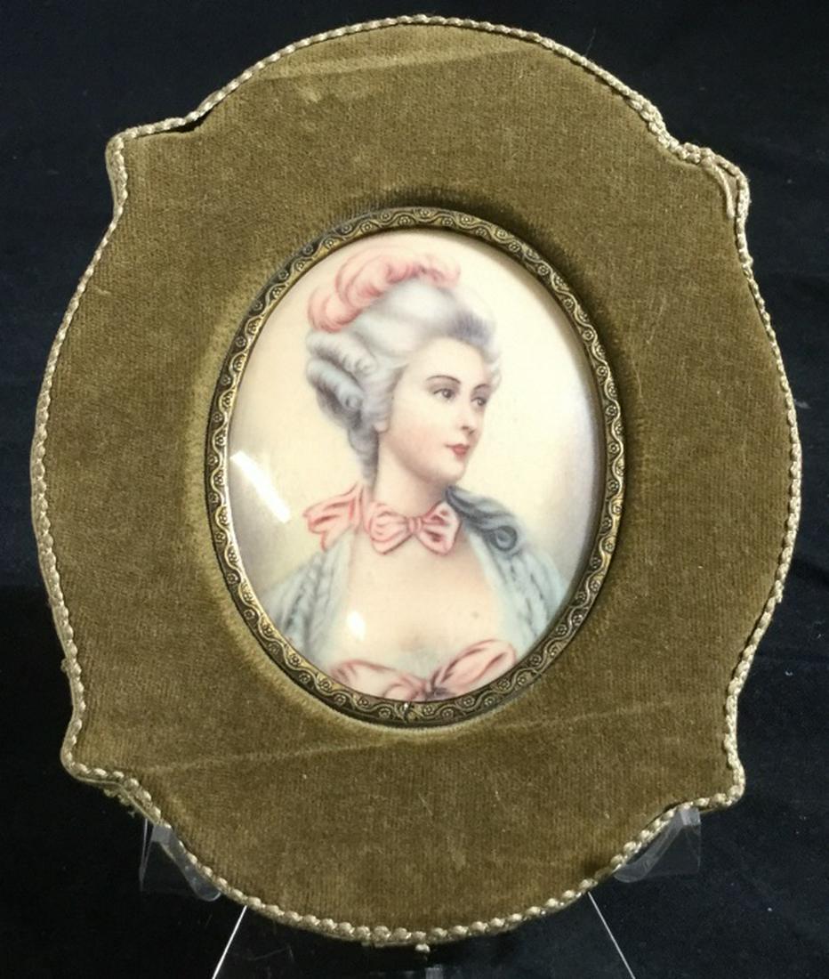 Portrait of Aristocratic French Woman: Moss Color Velvet Frame with a Decor Ribbon On Side. Sateen type backing. Plain Glass over art. Finely nailed. Very solid condition. Hook to hang. 6.5 x 5 in. Crease lines in the velvet. French Frame,