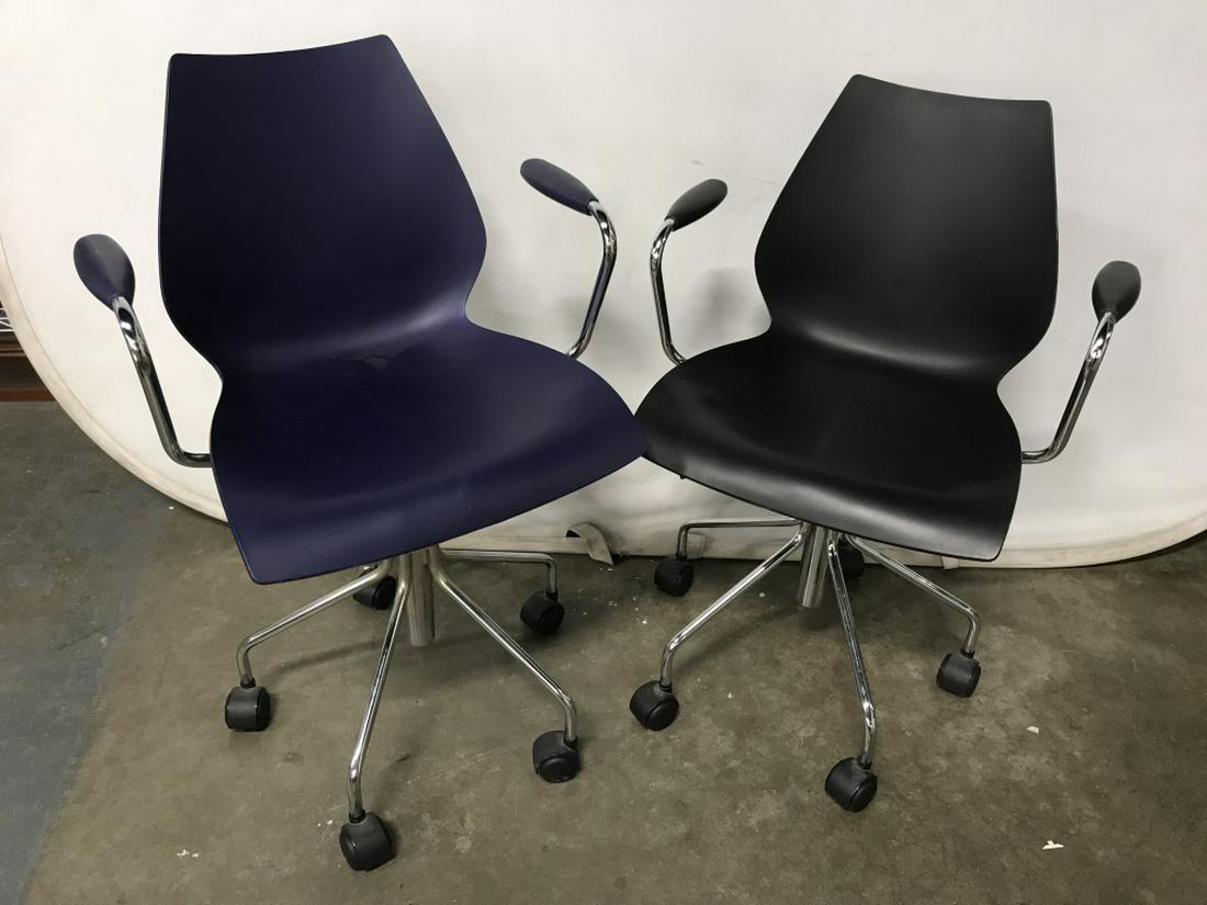 Pair Vico Magistretti for Kartell Office Chairs: Chairs are adjustable and on wheels. Each measures approx 32.20 inches in height by 22.5 inches in width by 19 inches in depth. Chairs are navy and black in tone with chrome hardware. Undersides are m