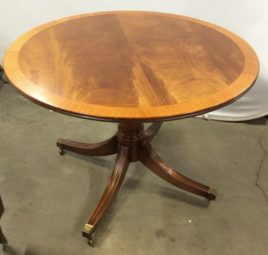 BEVAN FUNNELL LTD Adjustable Kitchen table: Made in England Round with pedestal base on casters, adjustable height, tallest 30 in, lowers to 23 in. Kitchen table, dinner table, coffee table, drinks / occasional table. Some surface wear. Measure