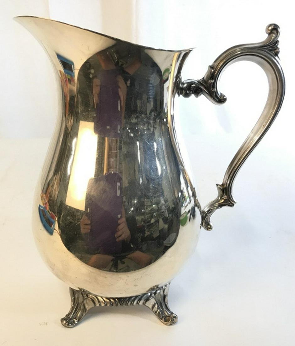 Silver Plate Footed Water Jug Pitcher: Decorative table ware, pitcher, vase,vessel measures ht app 10 inches spout to handle app 8.5 inches, decorative arts