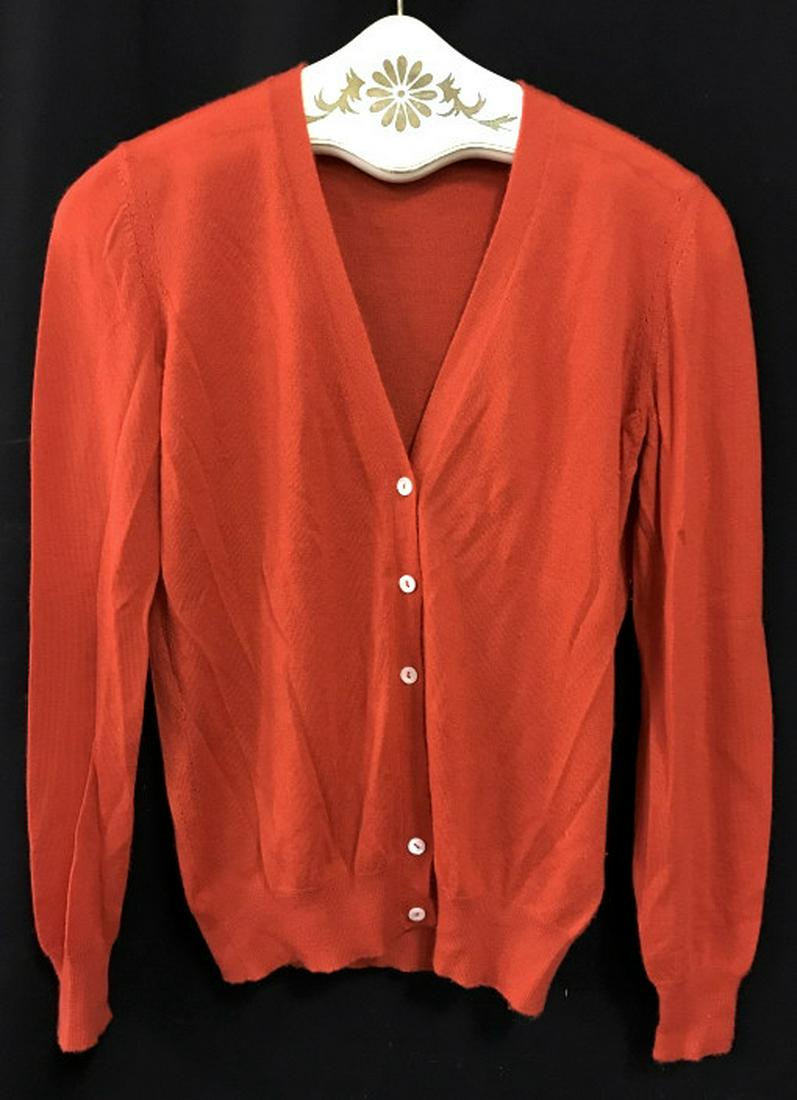 LORO PIANA Luxury Designer Cashmere Cardigan: Label reads for LORO PIANA, Made In Italy, Size 40, 100% Cashmere. Button down cardigan is vermillion red in tone. Good condition, except one button needs replacing. Luxury Designer fashion accessory,