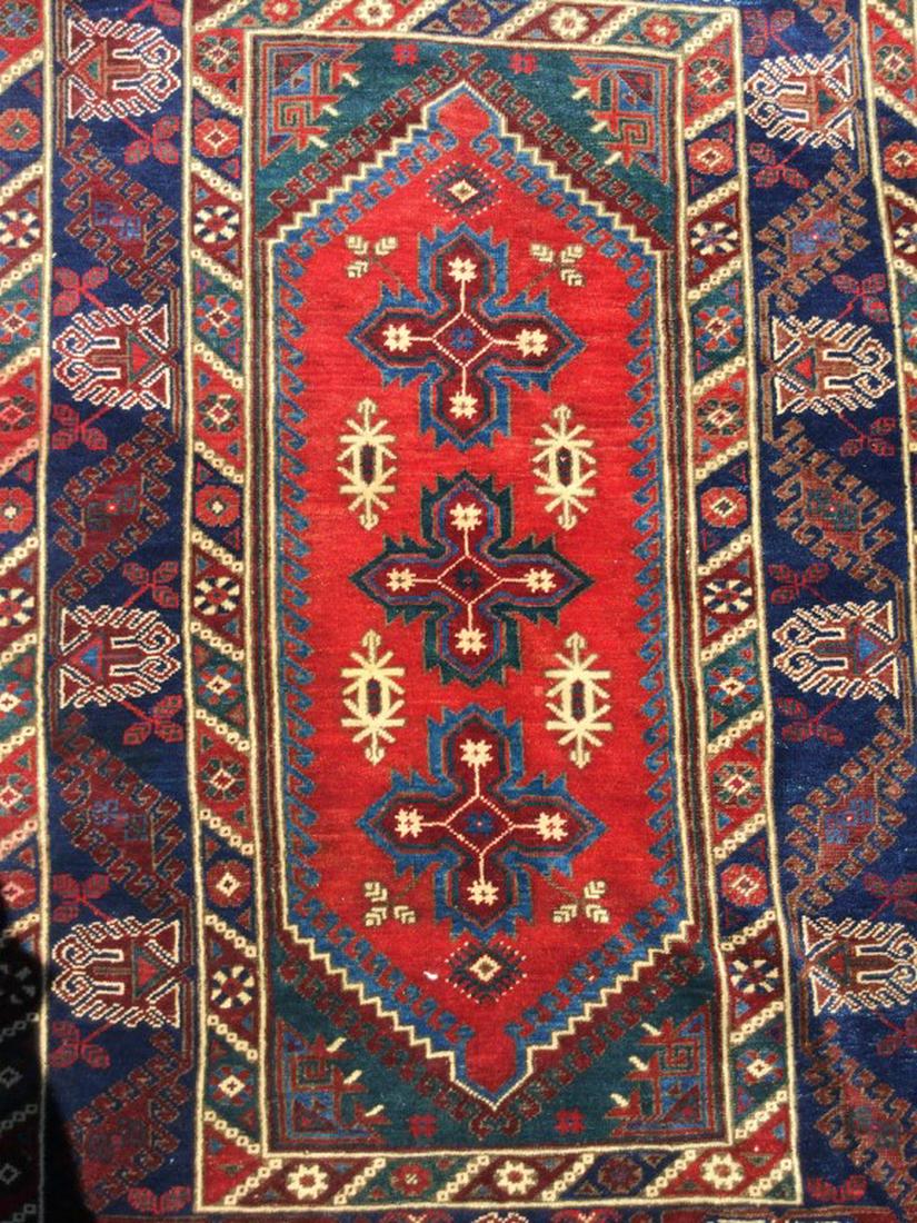 Vintage Handmade Fringed Wool Rug: Piece is vintage & handmade. Contains tones of red, cream, navy& dark teal. Contains fringes. Measures approx 74 inches long 46 inches wide. Rug, carpet, home accent, home accessory and decor. 6