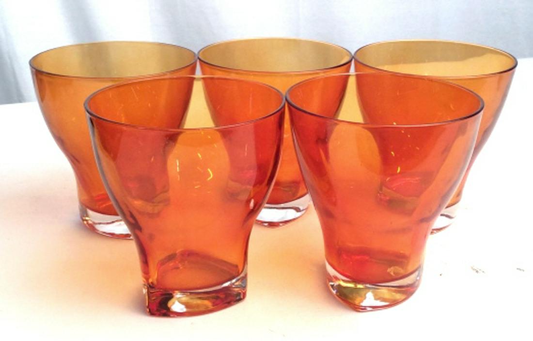 Orange Drinking Glasses Set: Set of five orange glasses, tableware, glassware, Set Of five, possibly hand crafted, hand formed, tabletop decor. Each measures at approx 5.5 inches in height and 5 inches in diameter. 8