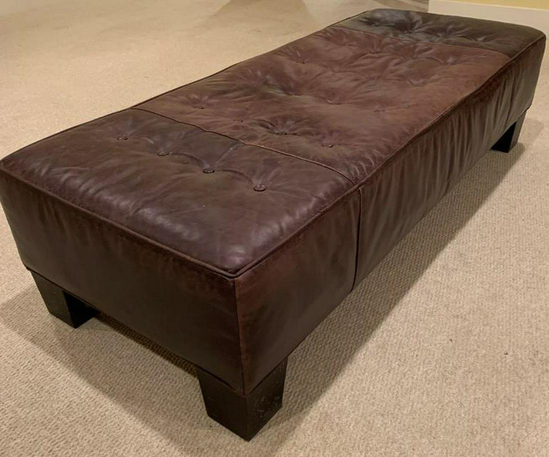 Vintage Tufted Leather Ottoman Bench: Piece is dark chocolate toned and leather. Top of piece is Tufted. Contains 4 black toned wooden feet. Contains evident wear. Measures approx 60 inches long, 16 inches tall, 25 inches deep. ottoman, b