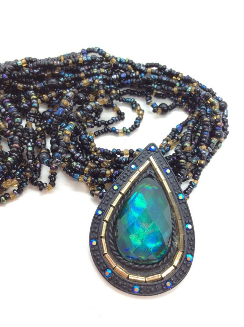 Chicos Beaded Rhinestone Pendant Necklace: Multi stranded Seed Bead Necklace e toned of black, purples and greens, tear drop shaped pendant with oversized past rhinestone and other added rhinestone details. Measures approx 9 1/2 in Long, women