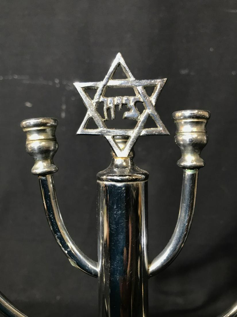 Silver Toned Metal Judaica Menorah: Menorah is silver toned. Center of piece has Star Of David. Measures approx 13.5 inches long 12 inches tall. judaica, hebraica, ceremonial tableware 6