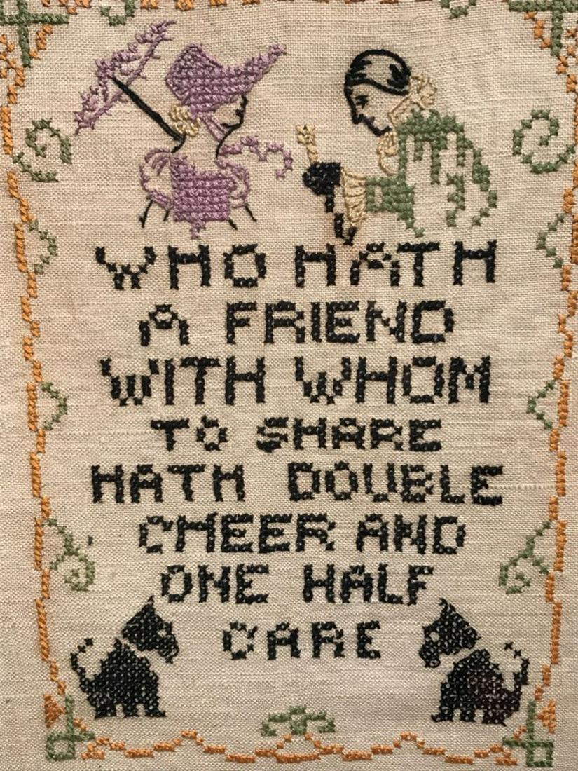 Vintage Motto Sampler W Inscription on Verso: Sampler features the saying ‘who hath a friend with whom to share hath double cheer and one half care.’ Embroidered figures with two dogs, along with pattern border. Sampler is set behind glass in