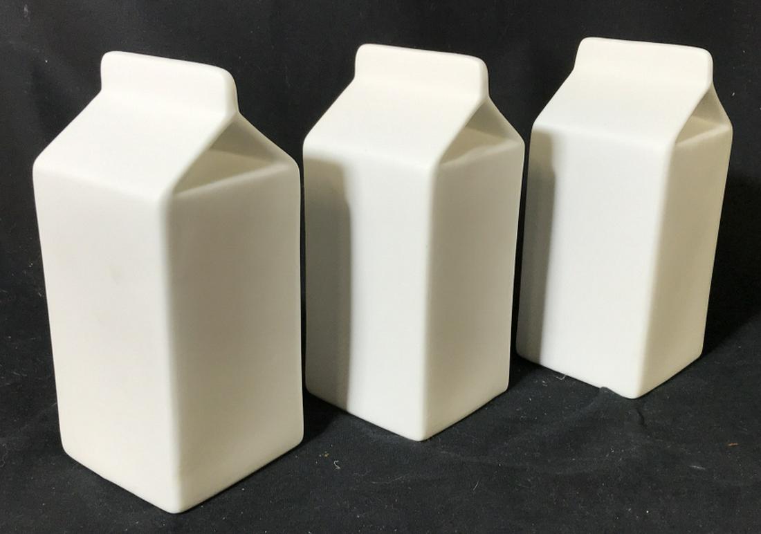 Set 3 Modern Porcelain Milk Carton Vases: A Colin Ross Design by James Burgess. Hallmark below. Bud vases, 3/4 in. Measure 6.5 x 6.5 x 6.5. Sleek with no chips, scratches or other surface marks. CB2 Store, Milk Carton Porcelain Vase, Modern D