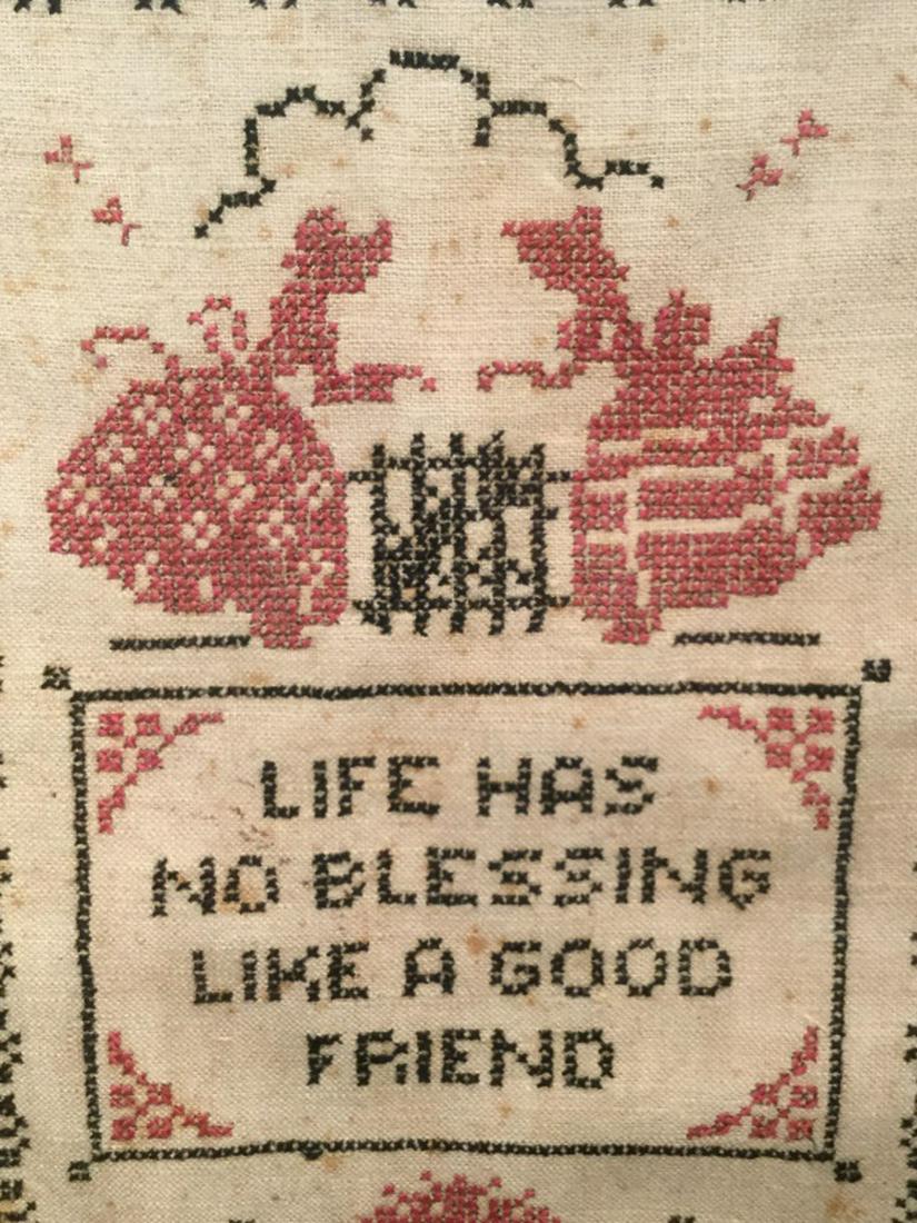 Vintage Motto Sampler W Ladies Motif: Sampler features the saying ‘Life has no blessing like a good friend.’ Embroidered figures in dresses and floral motifs, along with pattern border. Sampler is set behind glass in wood frame. Frame