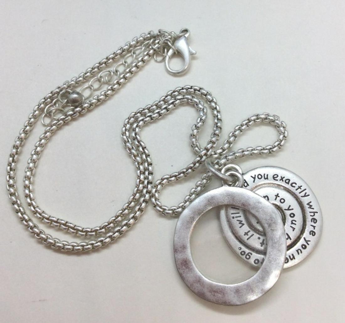 Silver Toned Metal Photo Locket Necklace: Light silver toned chain necklace with two charms, one with inscription “listen to your heart, it will lead you where you need to go”, one with open center for small photograph. Measures approx 10