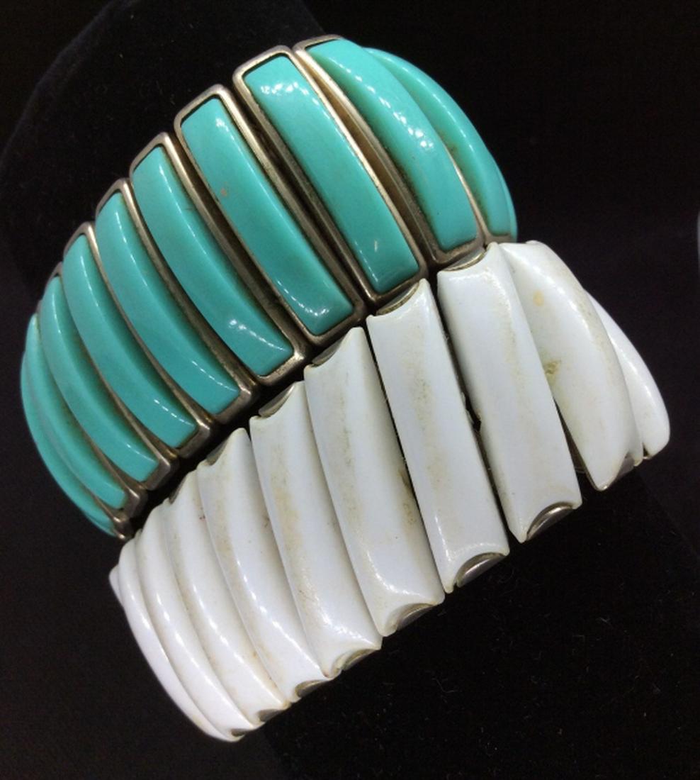 Lot 2 Retro Metal Stretch Bracelets: Lot 2, dark toned silver metal base, Stretch Bracelets, with composite material details in tones of white and turquoise, possibly Bakelite. Turquoise toned bracelet marked for Trifari. Surface wear ap