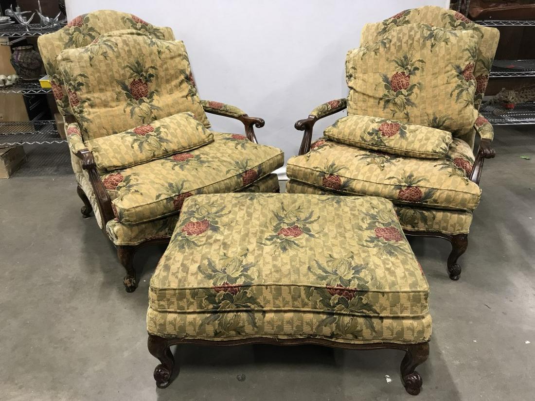 Lot 3 WESLEY HALL Bergere Chairs & Ottoman: Tag underneath cushion reads WESLEY HALL. Lot includes 2 Bergere chairs & 1 ottoman. Each piece has floral & leaf detail & carved Wooden detail. Each chairs includes backrest cushion& pillow. Upholste
