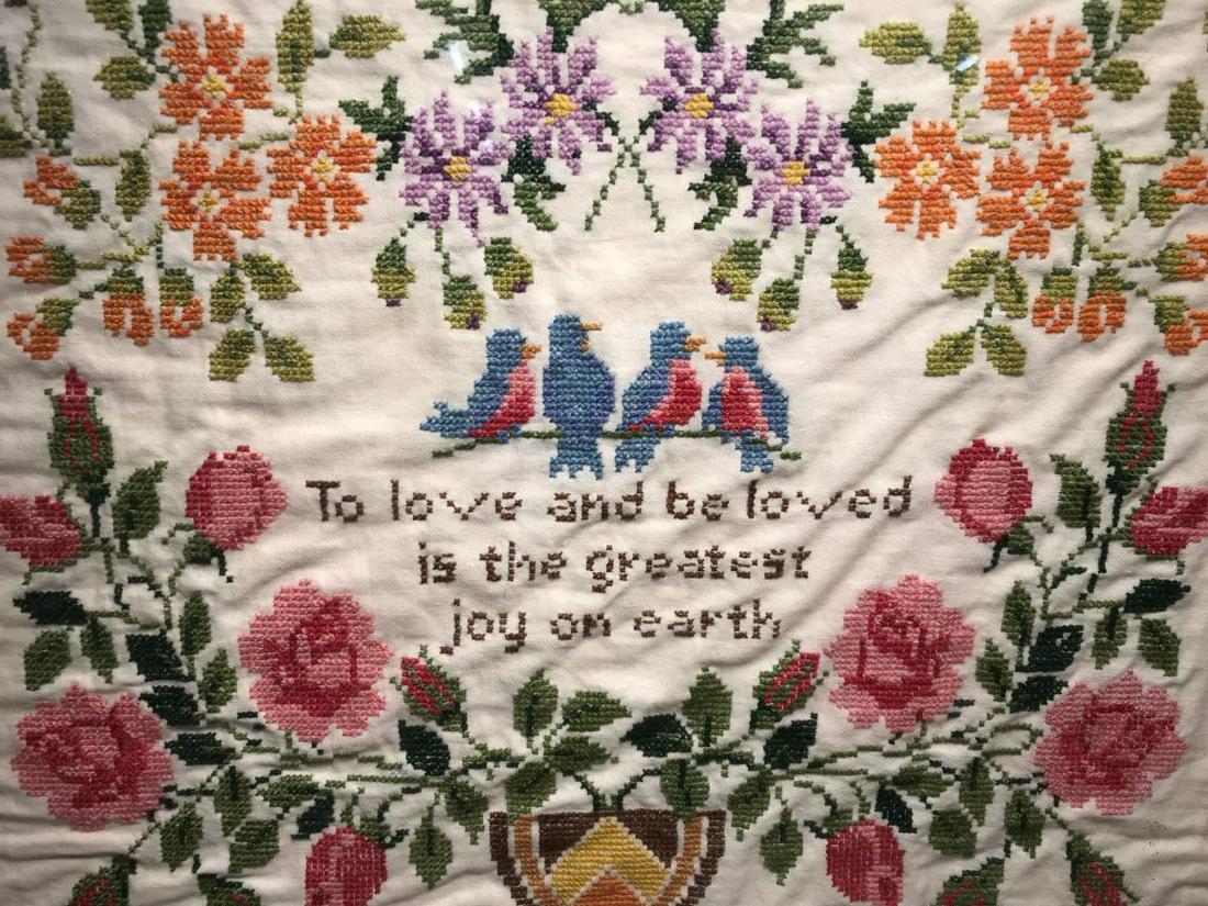 Vintage Motto Sampler W Bird & Floral Motifs: Sampler features the saying ‘To love and be loved is the greatest joy on earth.’ Embroidered birds and flowers in vase motifs. Sampler is set behind glass in gold tone metal frame. Frame measures