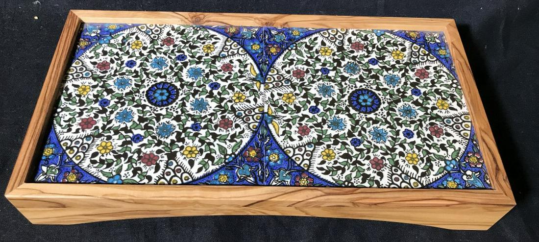 HAND PAINTED Tiled Trivet: Pottery from Jerusalem. Sticker on underside. Stands 1.5 in. off table and sits in wood frame. Tiles are indented in frame. Measures 11 3/4 x 6 1/4 in. Tabletop, Table Trivet, Hand Painted porcelain T