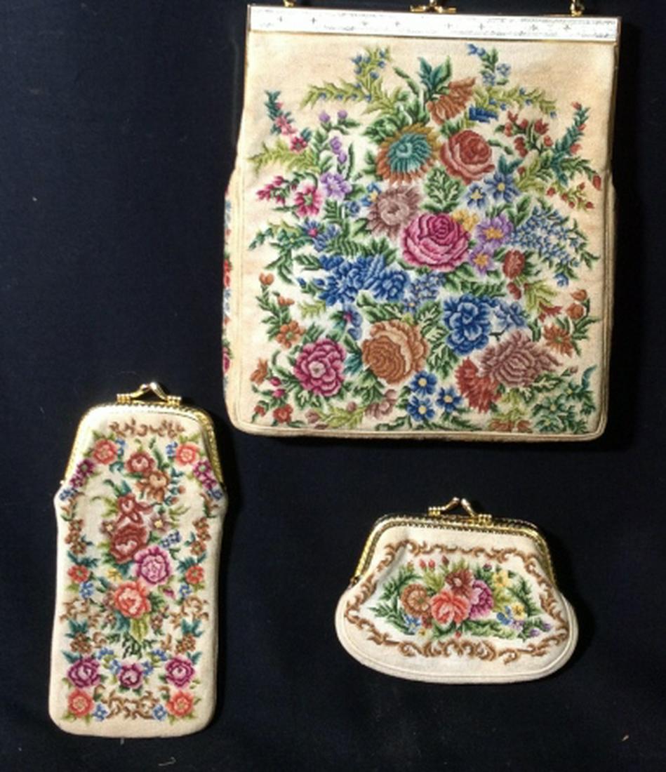 Vintage HAND EMBROIDERED Purse Set: Brand called Petit Point. Thin Shoulder Bag with gold tone rope strap, snap closure. Measures 8 3/8 x 7 1/4 x 1. Strap 16.5 in. Matching eye glass case and change purse. Possibly needs cleaning. Hand 