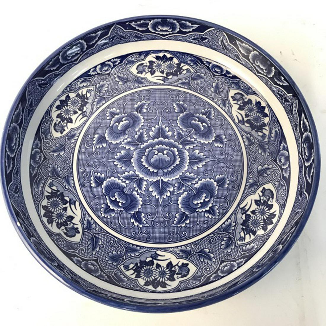 Blue & White Toned Asian Style Porcelain Plate: Piece is blue and white toned with intricate floral and leaf detail. Measures approx 12 inches wide, 2.5 inches tall. asian arts and crafts, decorative arts and accessories, tableware wall shelf, shel