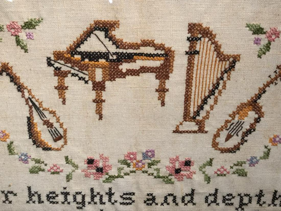 Vintage Motto Sampler W Musical Instruments: Sampler features embroidered musical instruments motifs, along with the saying ‘For heights and depths no words can reach, music is the soul’s own speech.’ Floral pattern border. Sampler is set