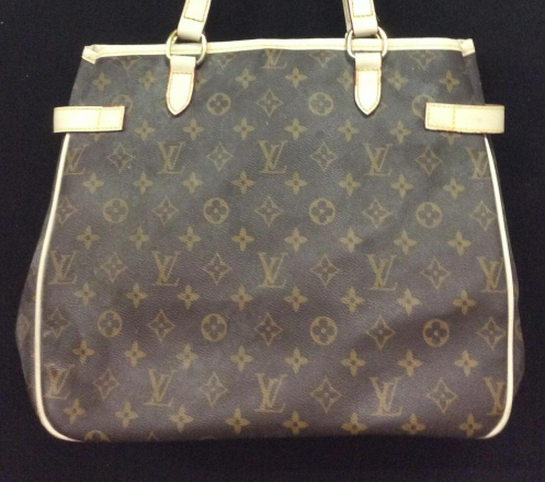 Louis Vuitton Classic Monogram Women’s Tote Bag: Traditional Brown Monogram. Very Clean Inside. Hardware Gold Metal. Side Buckles to Adjust Bag Width. Inside Clip to Close. Inside Zipper and Pocket. Needs Outside Cleaning. Piping and stitching in Go
