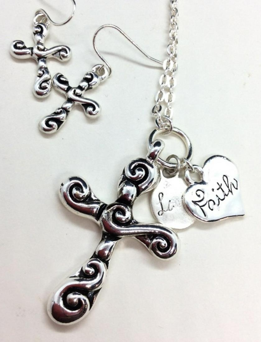 Silver Toned Metal Cross Jewelry Set: Light silver toned metal, cross with charms in chain necklace with matching earrings. Religious jewelry. measures app 11 in long. Some minor surface wear Women’s vintage costume estate jewelry, fash