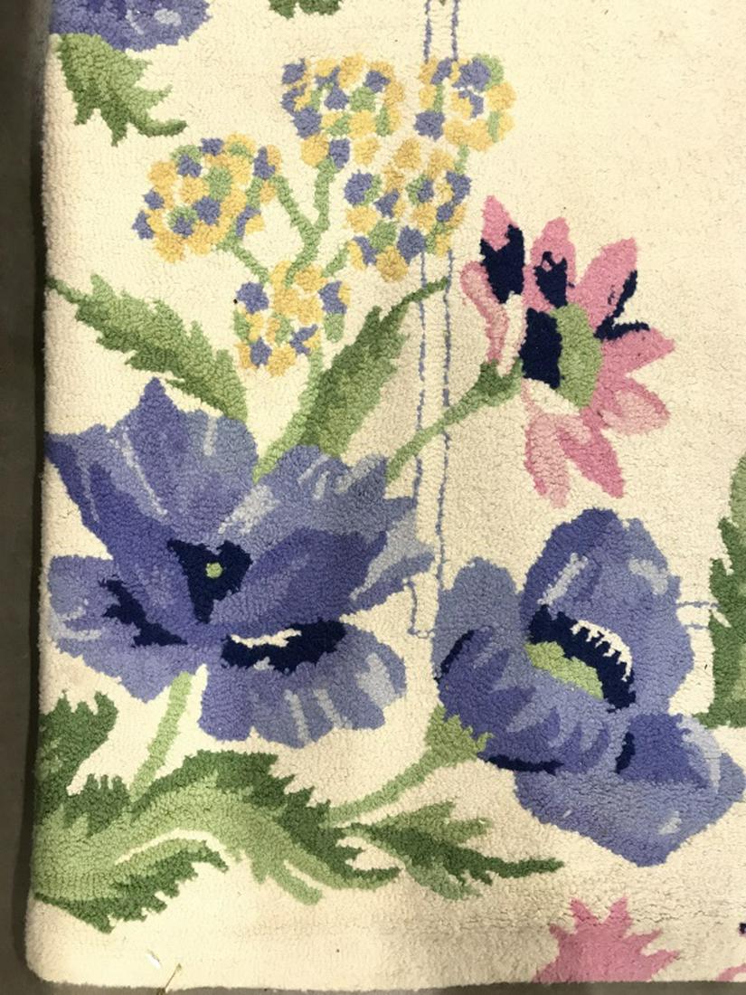 Floral Detailed Wool Rug: Rug contains multi toned floral and leaf detail. Contains tones of blue, green, pink, cream, and yellow. Rug appears to be wool. Floral rug, area rug, carpet. Measures approx 120 inches long 93 inches