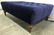 Blue Toned Tufted Ottoman W Wooden Feet Ottoman is blue