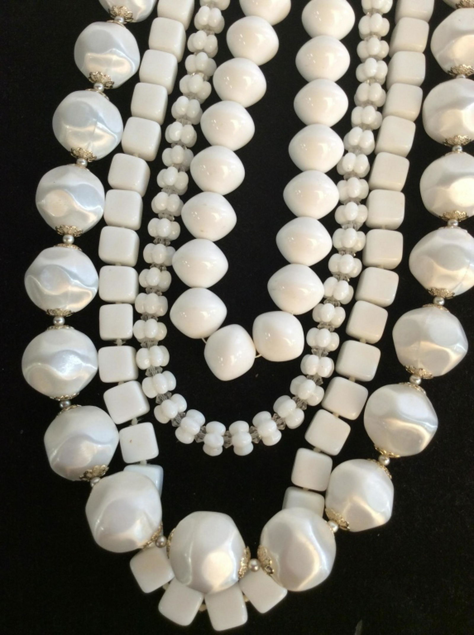 Lot 4 White Beaded Costume Necklaces One marked Vogue: One marked Vogue one marked Trifari. White toned composite material necklaces, various lengths, women’s vintage costume estate jewelry, Ladies Statement Necklaces and wearables, 4