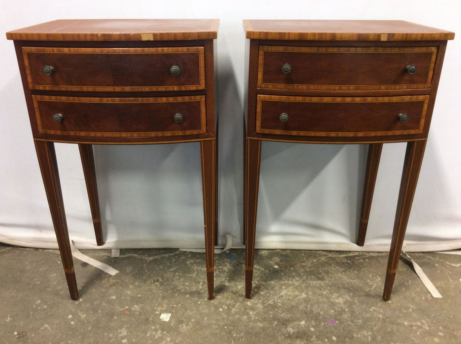JOHN WIDDICOMB Vintage Wooden Side Tables: Lot includes 2 carved wooden side tables. Each table has 2 drawers. Each with 2 metal small knob style handles. Measures approx 28 inches tall 17 inches wide 13 inches deep. Pieces have some wear & mi