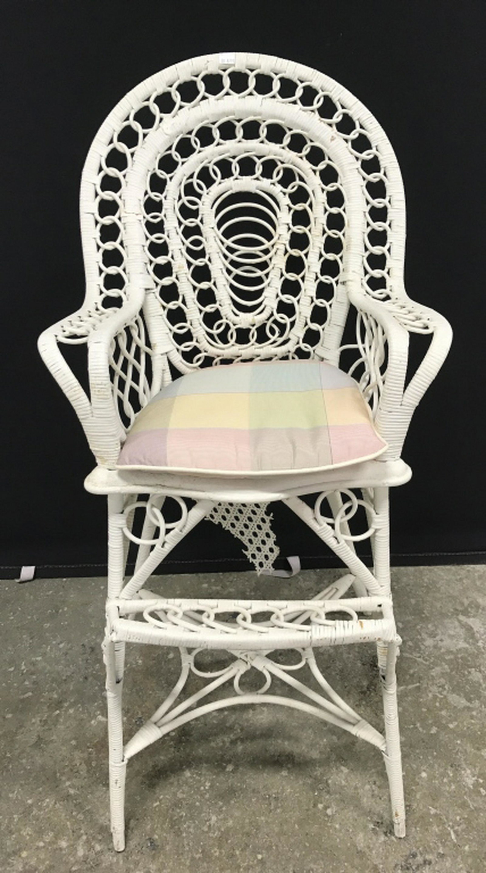 Children’s Painted Wicker High Chair W Footrest: Chair is painted white in tone. Caning Of Seat will need repair as there is substantial surface wear. Additional minor surface wear like chipping of paint. Measures approx 37.5 inches in height by 18.