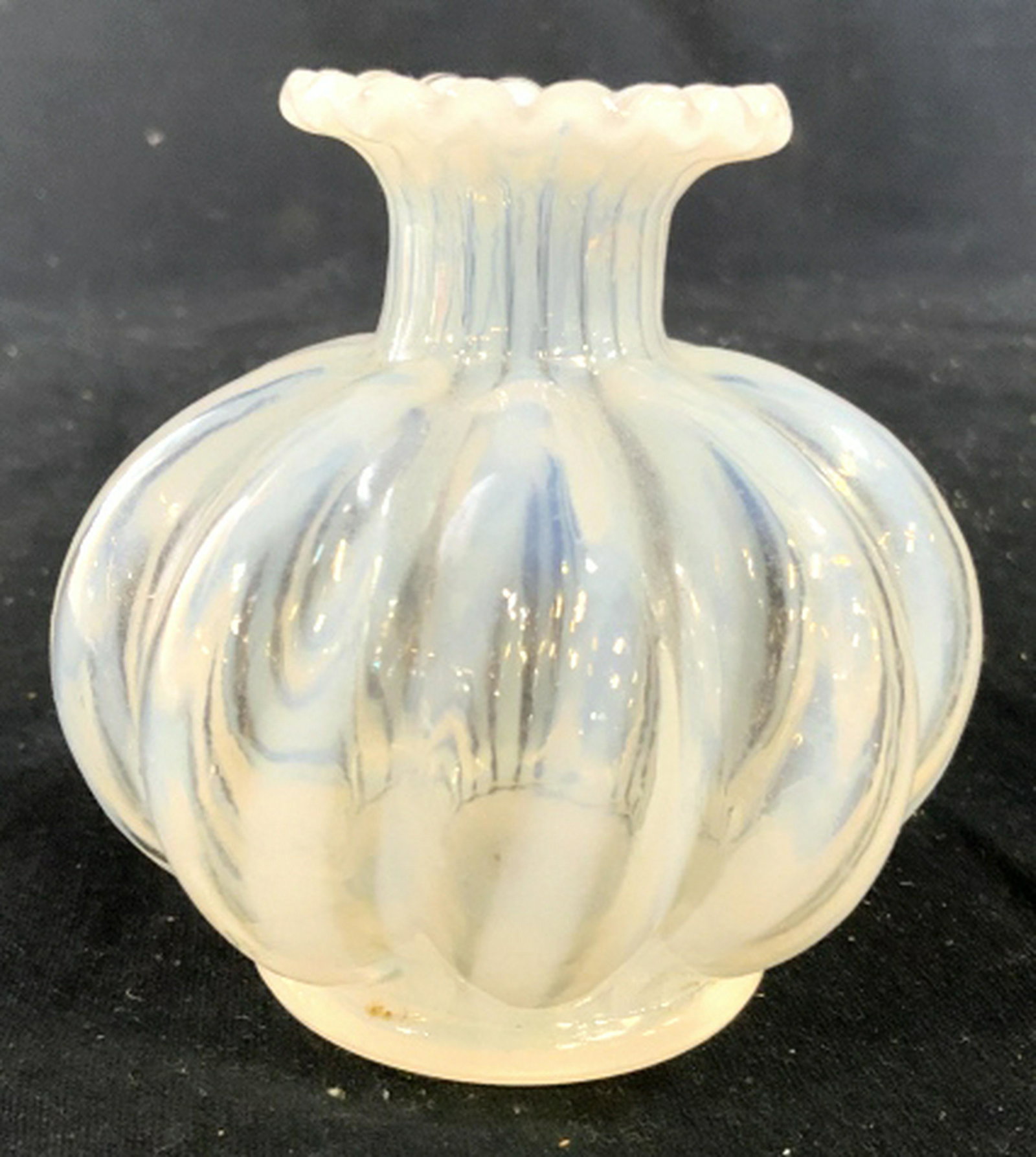 Hand Formed Art Glass Bottle Vase: Swirl pattern art glass table ware, decorative accessory measures ht 3.5 inches diameter app 4 inches