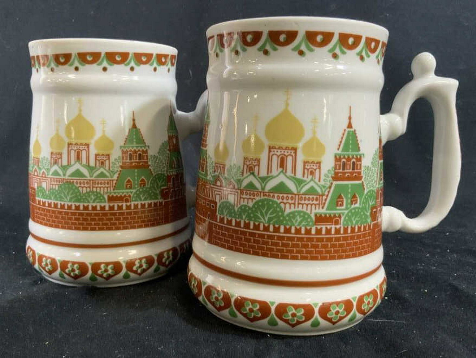 Pair Signed Russian Porcelain Tankards: Russian porcelain, ceramics, pottery, mugs, tankards, tableware, each measures app ht 6 inches rim to handle 6 inches